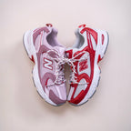 New Balance 530 running sneakers in red, white, and lavender with mesh and suede details