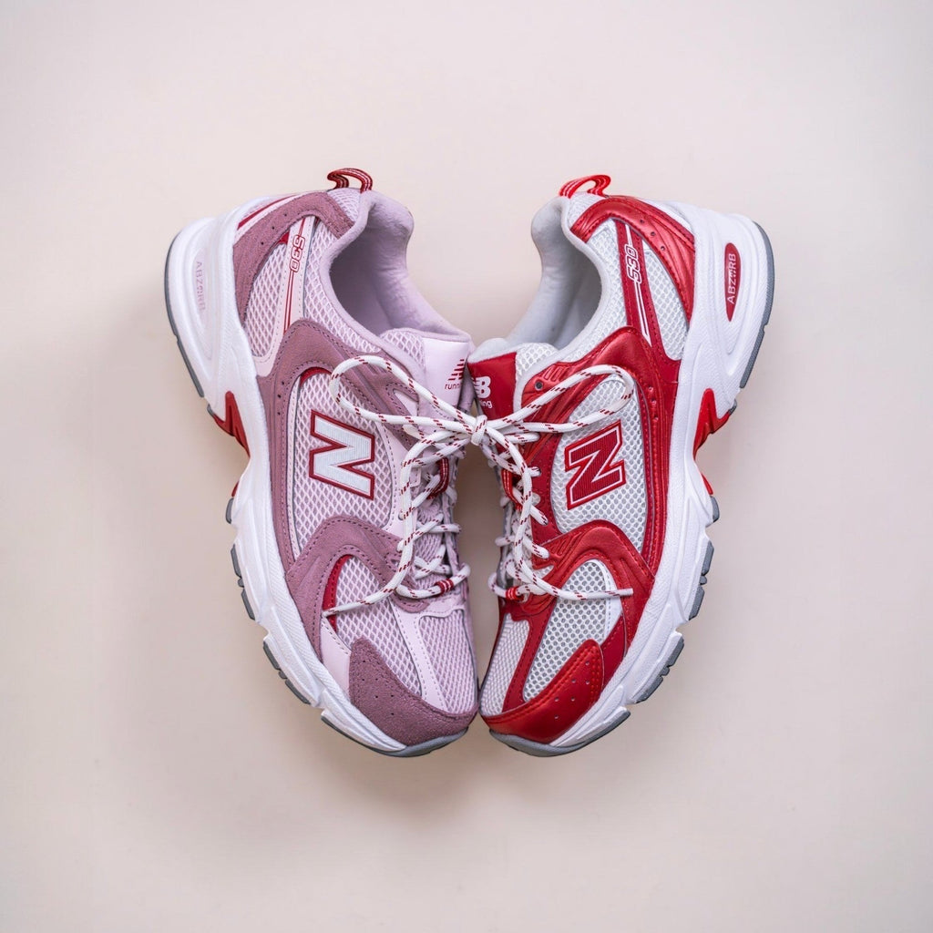 New Balance 530 running sneakers in red, white, and lavender with mesh and suede details