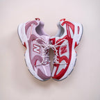 New Balance 530 running sneakers in red, white, and lavender with mesh and suede details