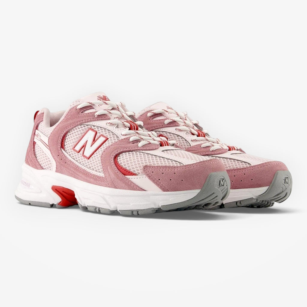 METRO New Balance 530 sneakers in rosewood pink with breathable mesh, synthetic overlays, and ABZORB cushioned midsole.
