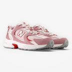 METRO New Balance 530 sneakers in rosewood pink with breathable mesh, synthetic overlays, and ABZORB cushioned midsole.
