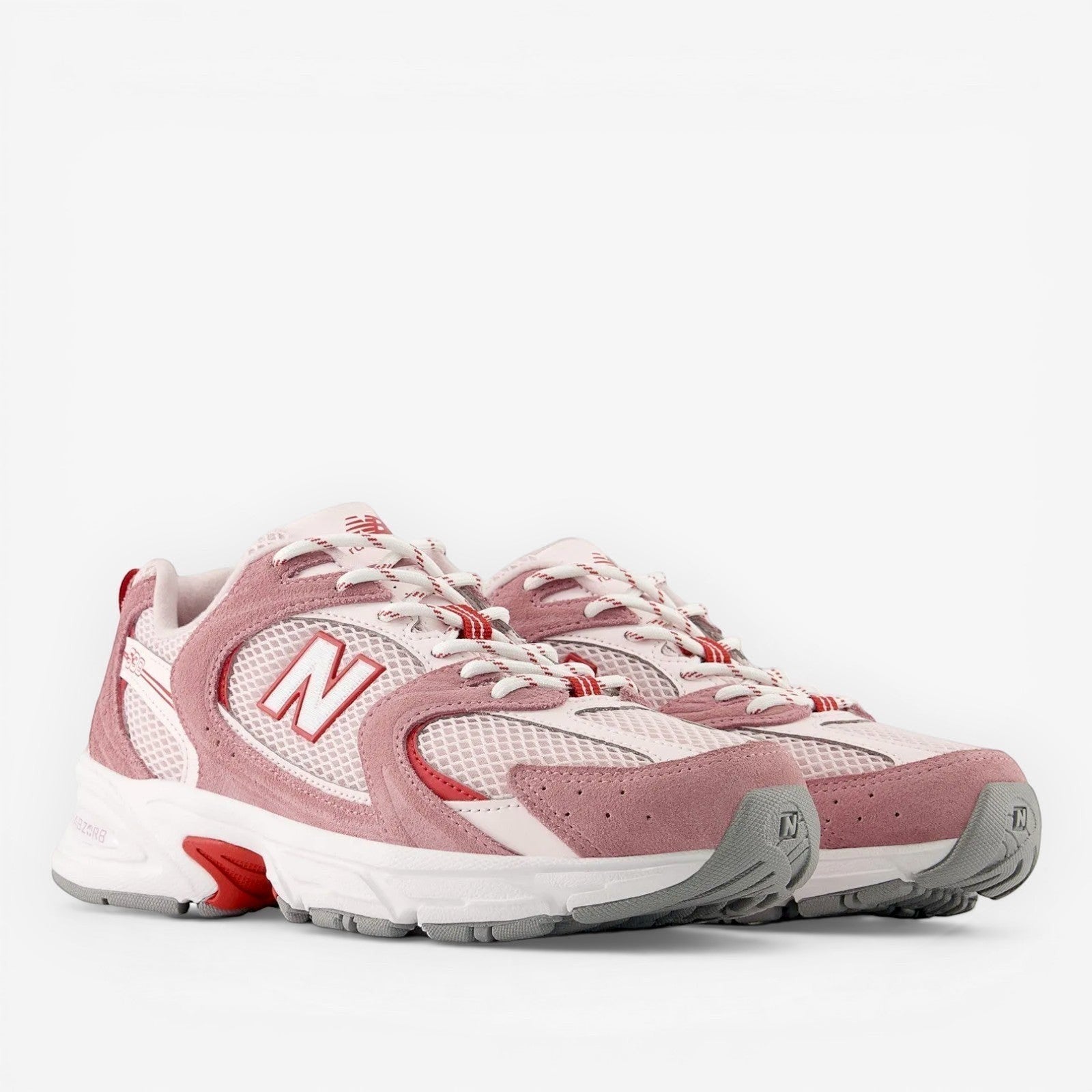 new balance sneakers in pink and white mesh with suede accents and chunky sole, footwear
