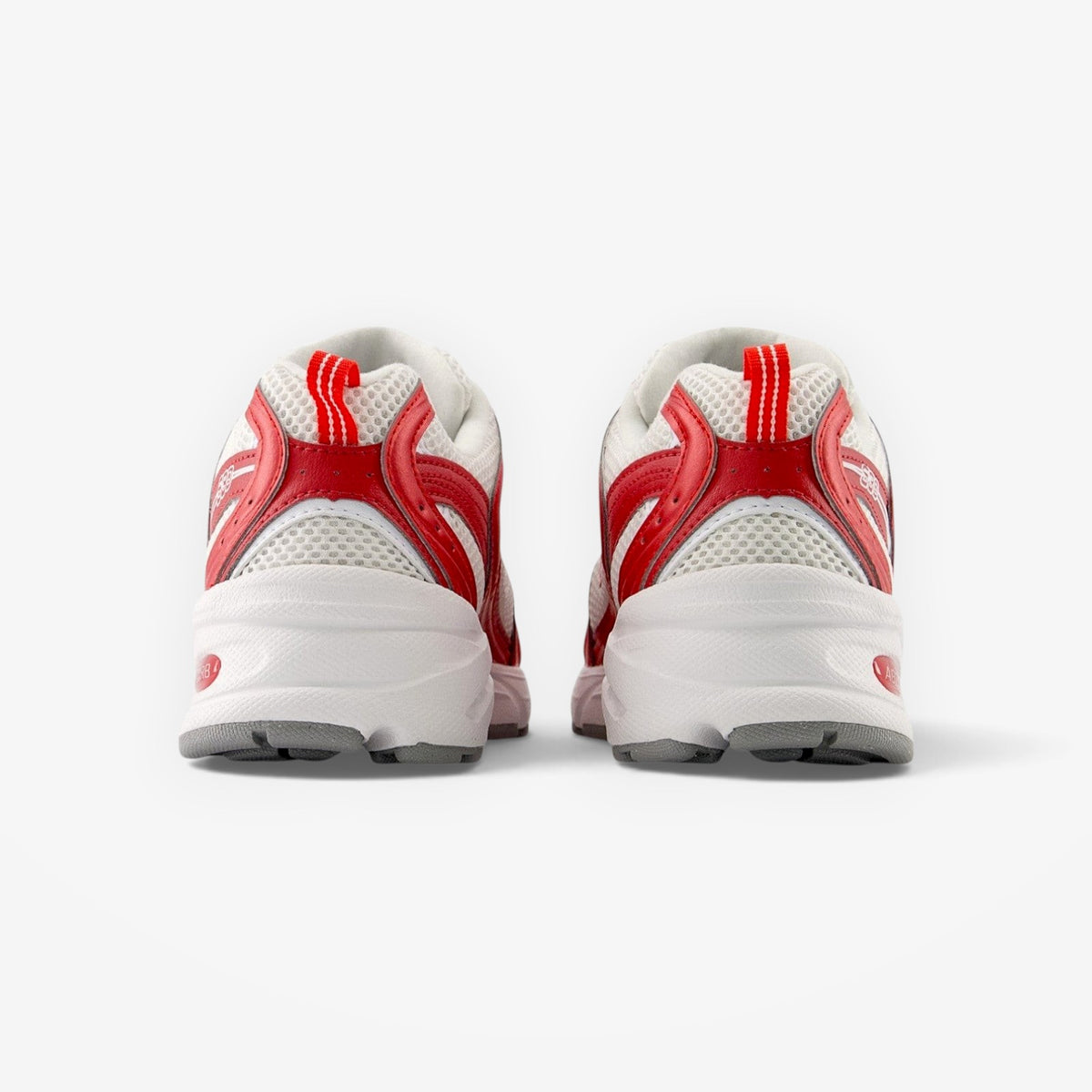 METRO New Balance 530 Shadow Red sneakers showing the rear view with white mesh, red synthetic overlays, and ABZORB sole