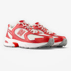 METRO New Balance 530 Shadow Red sneakers featuring a breathable white mesh upper with bold red synthetic overlays.