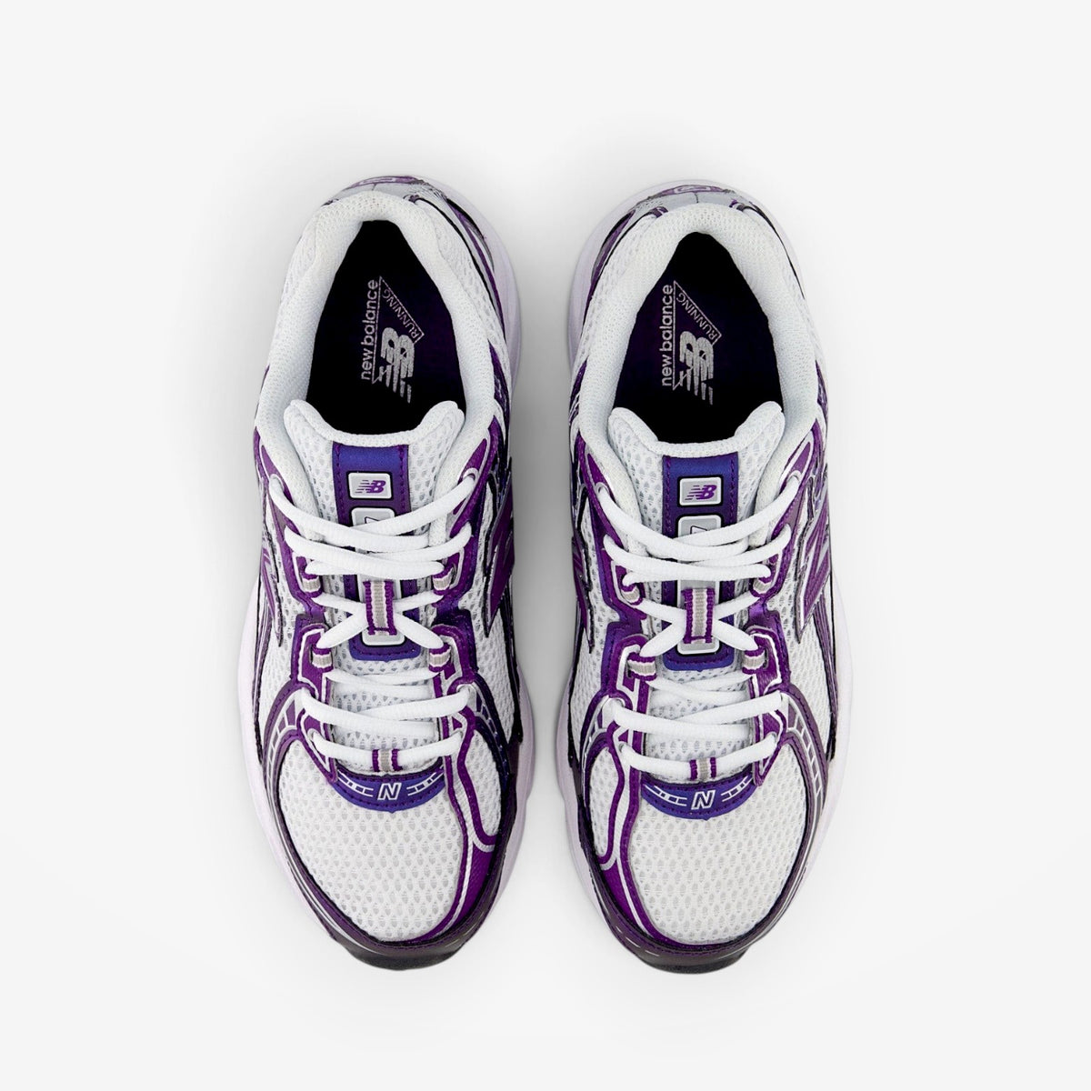 Top-down view of METRO New Balance 740 sneakers in Concord Grape featuring white mesh and purple suede overlays.