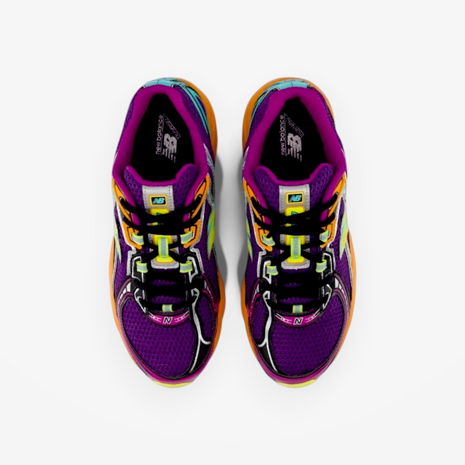 METRO New Balance 740 running shoes in purple mesh with orange and neon yellow accents, top-down view.