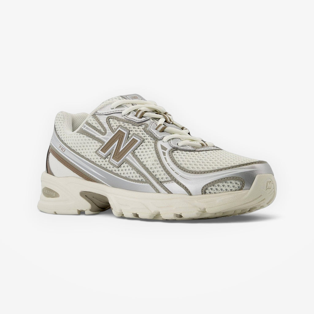 METRO New Balance 740 sneaker in white and grey with breathable mesh, synthetic overlays, and cushioned midsole.