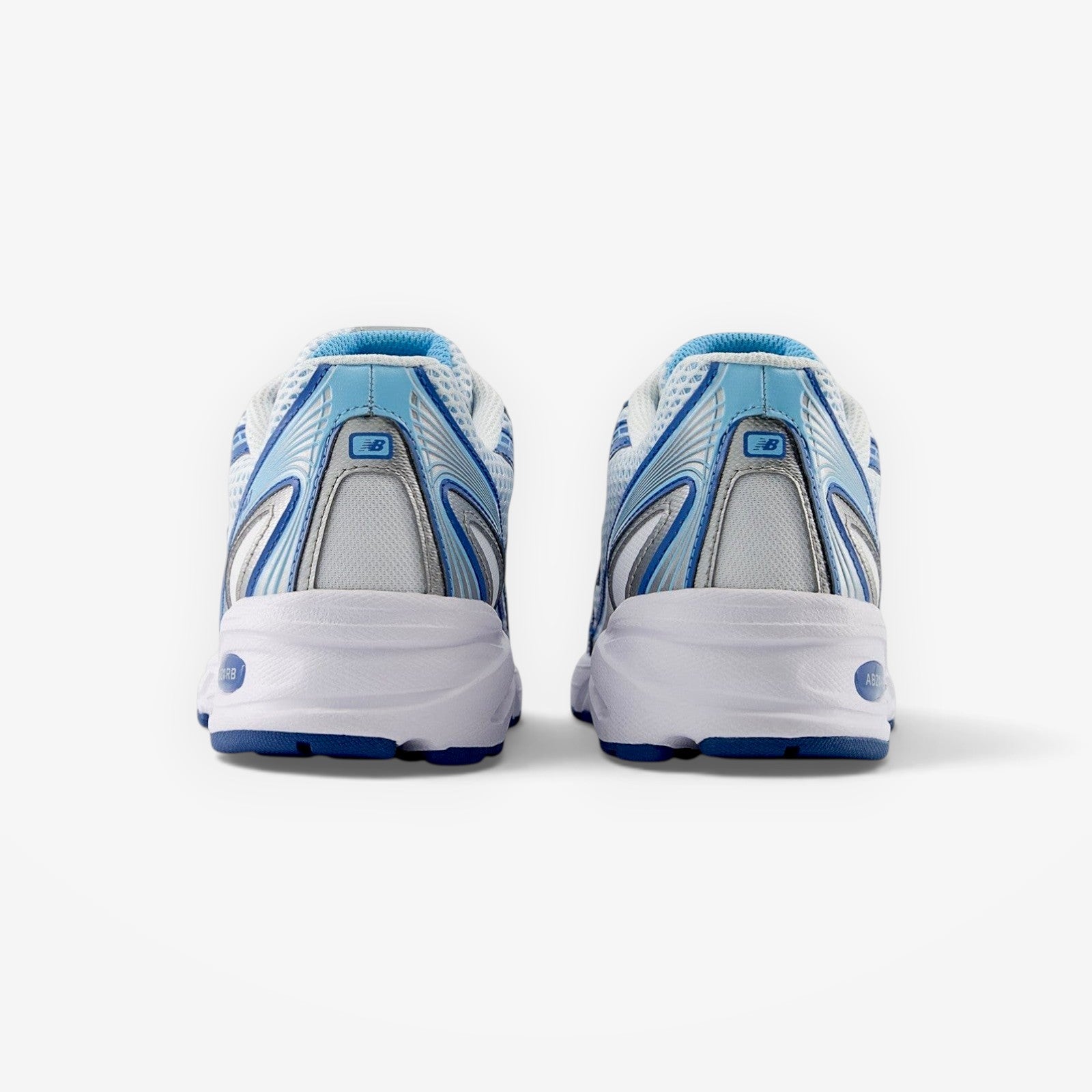 Rear view of METRO New Balance 740v2 sneakers in blue agate and white with mesh and suede details