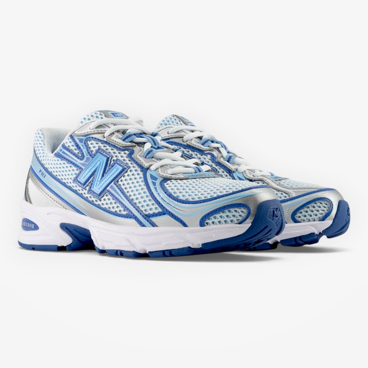 METRO New Balance 740v2 sneakers in blue agate and white with mesh, suede, and synthetic overlays.