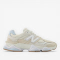 Cream and white New Balance sneaker with mesh and suede details, athletic footwear
