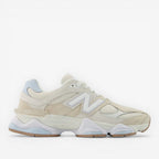 Cream and white New Balance sneaker with mesh and suede details, athletic footwear