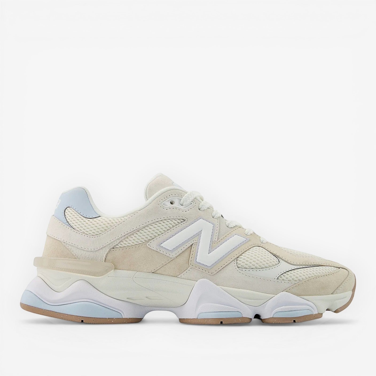 Cream and white New Balance sneaker with mesh and suede details, athletic footwear