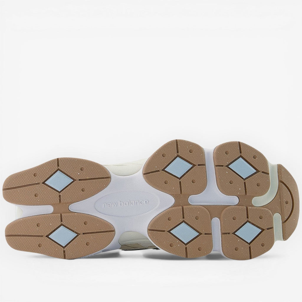 New Balance sneaker outsole with tan, white, and blue details, stylish footwear design