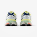METRO New Balance 9060 Ice Blue sneakers, rear view showing sculpted midsole, mesh upper, and vibrant accent details.