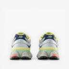 New Balance sneakers rear view, pastel color accents, mesh and leather footwear