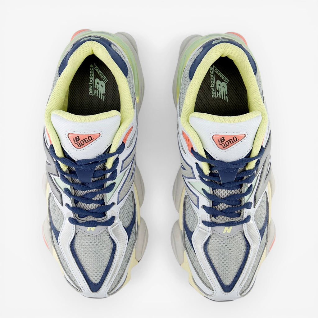 New Balance sneakers in blue, grey, and yellow with mesh upper, viewed from above