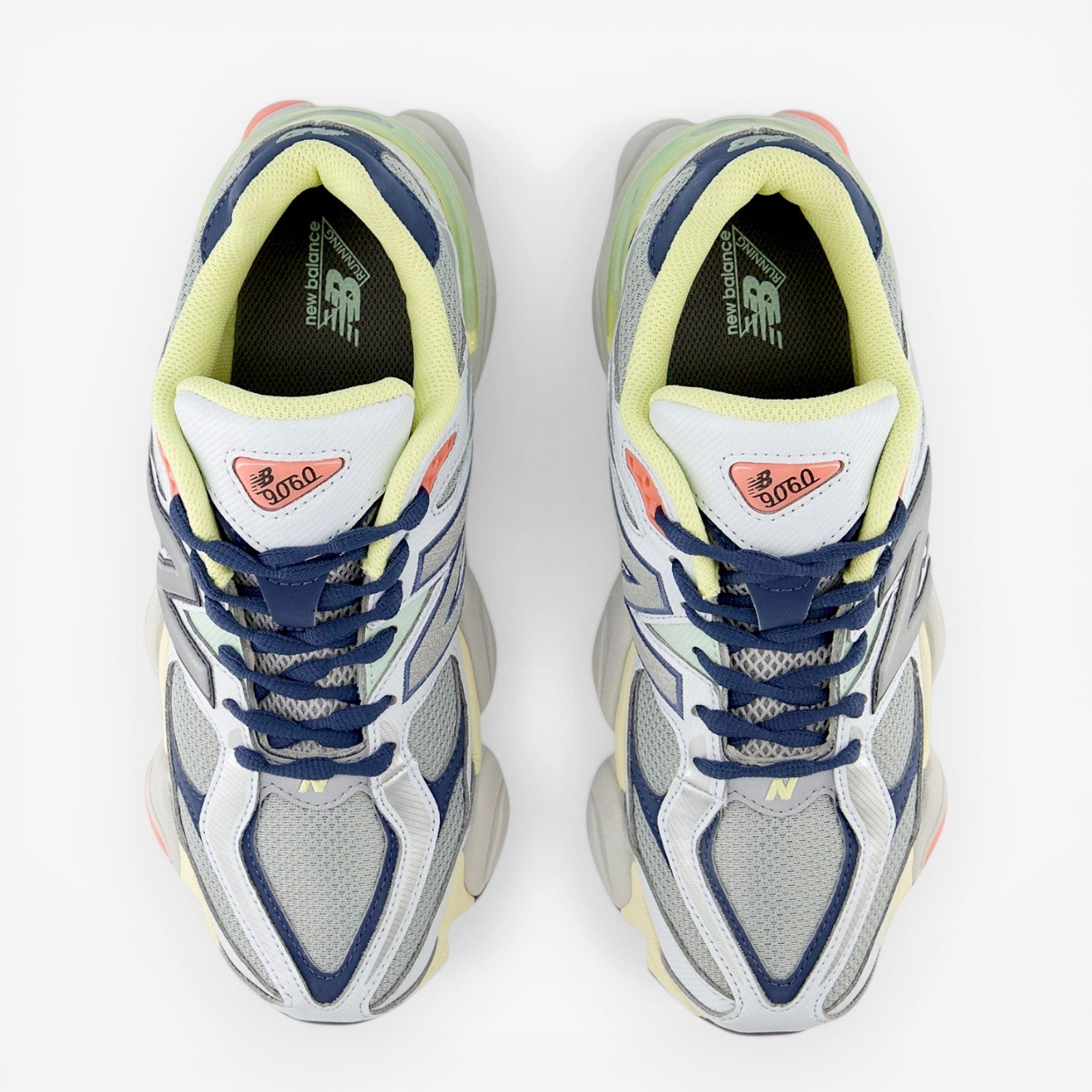 New Balance sneakers in blue, grey, and yellow with mesh upper, viewed from above