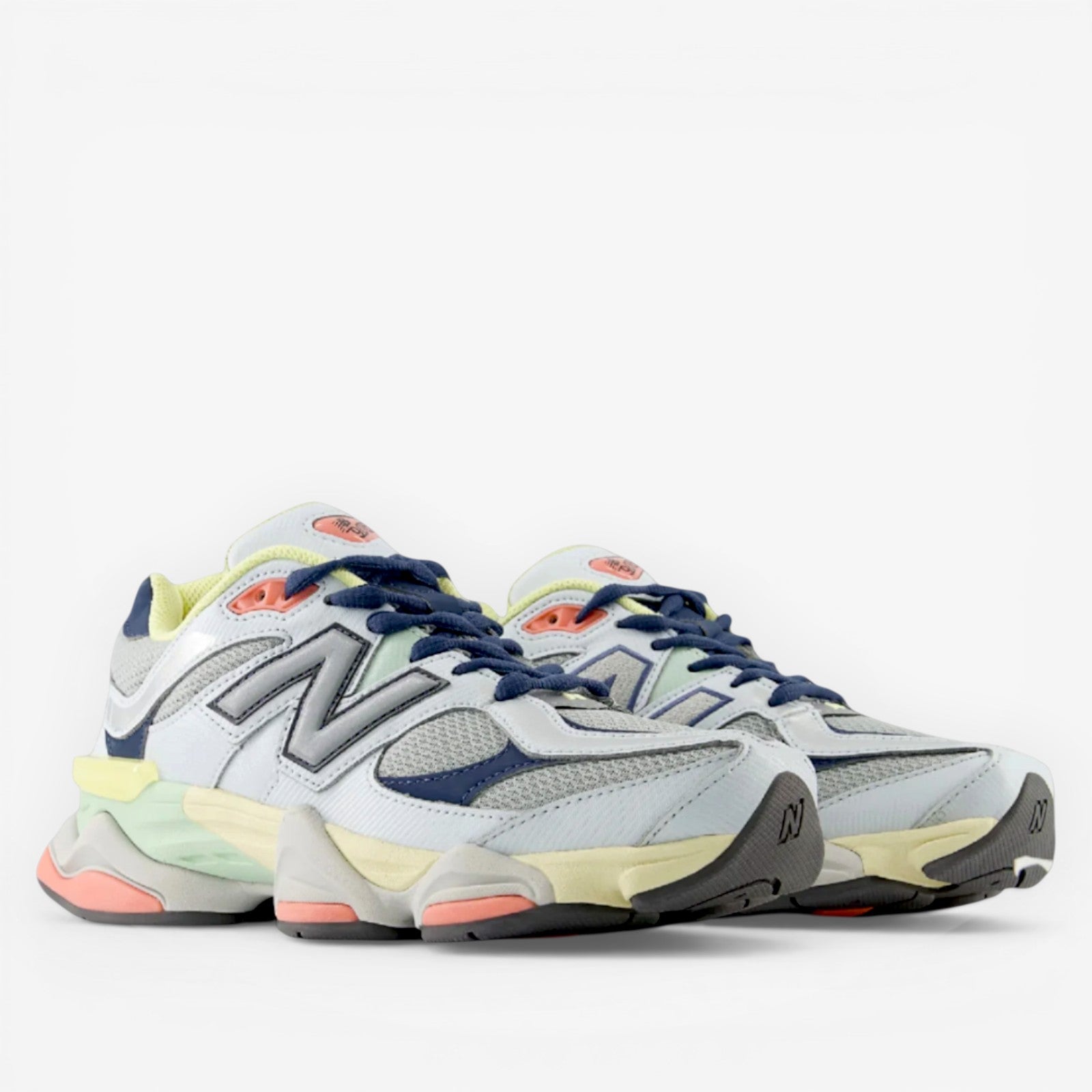 new balance sneakers in grey, navy, and pastel with mesh and suede panels, lifestyle footwear