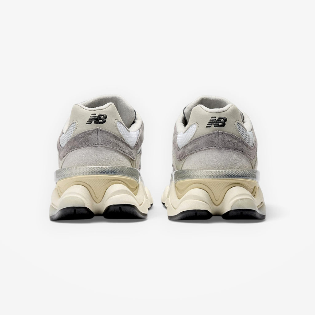 METRO New Balance 9060 Rain Cloud sneakers showing the rear view with grey suede, mesh, and sculpted cream midsole.
