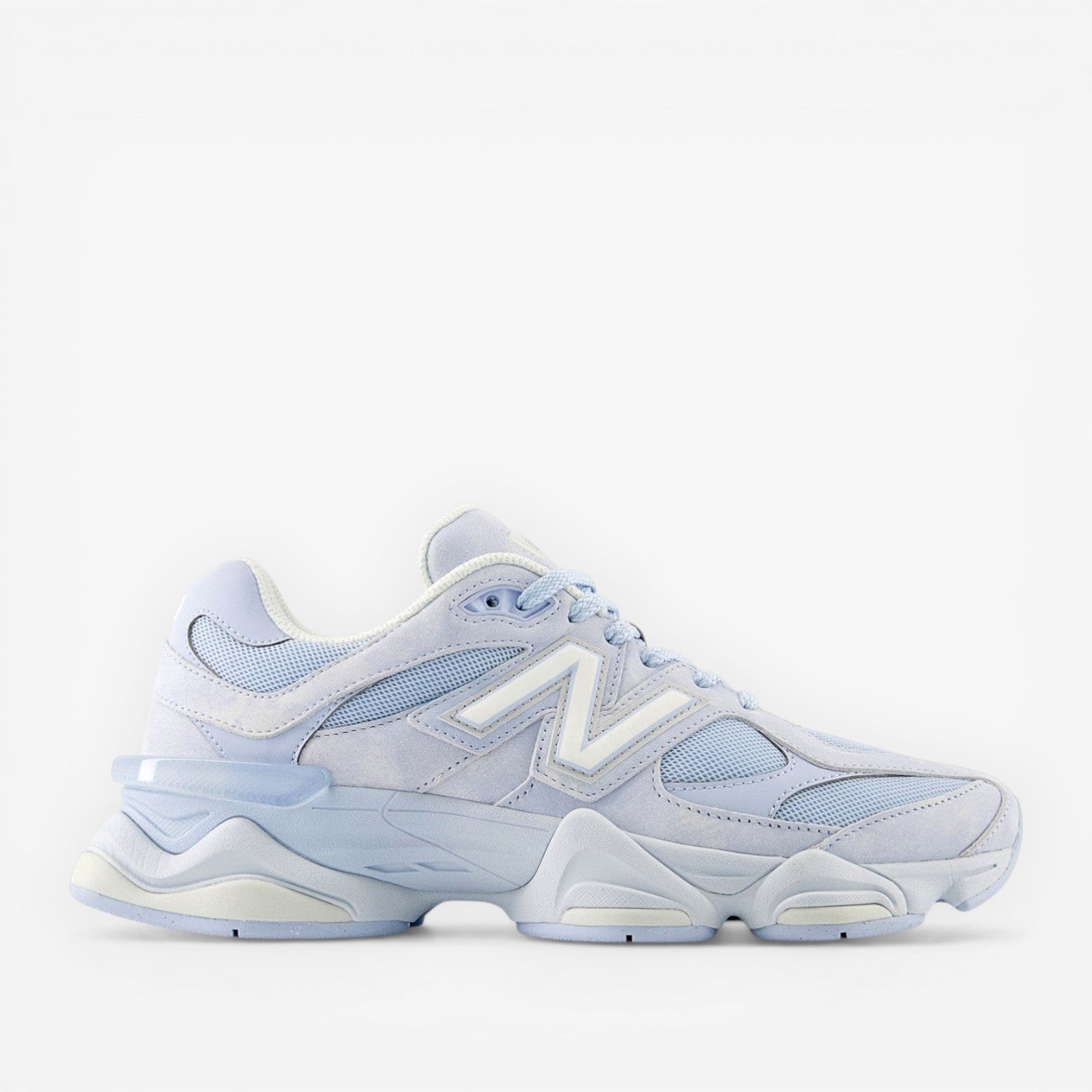 METRO New Balance 9060 sneakers in sea salt and oxford blue, made with mesh and suede overlays. Y2K style.
