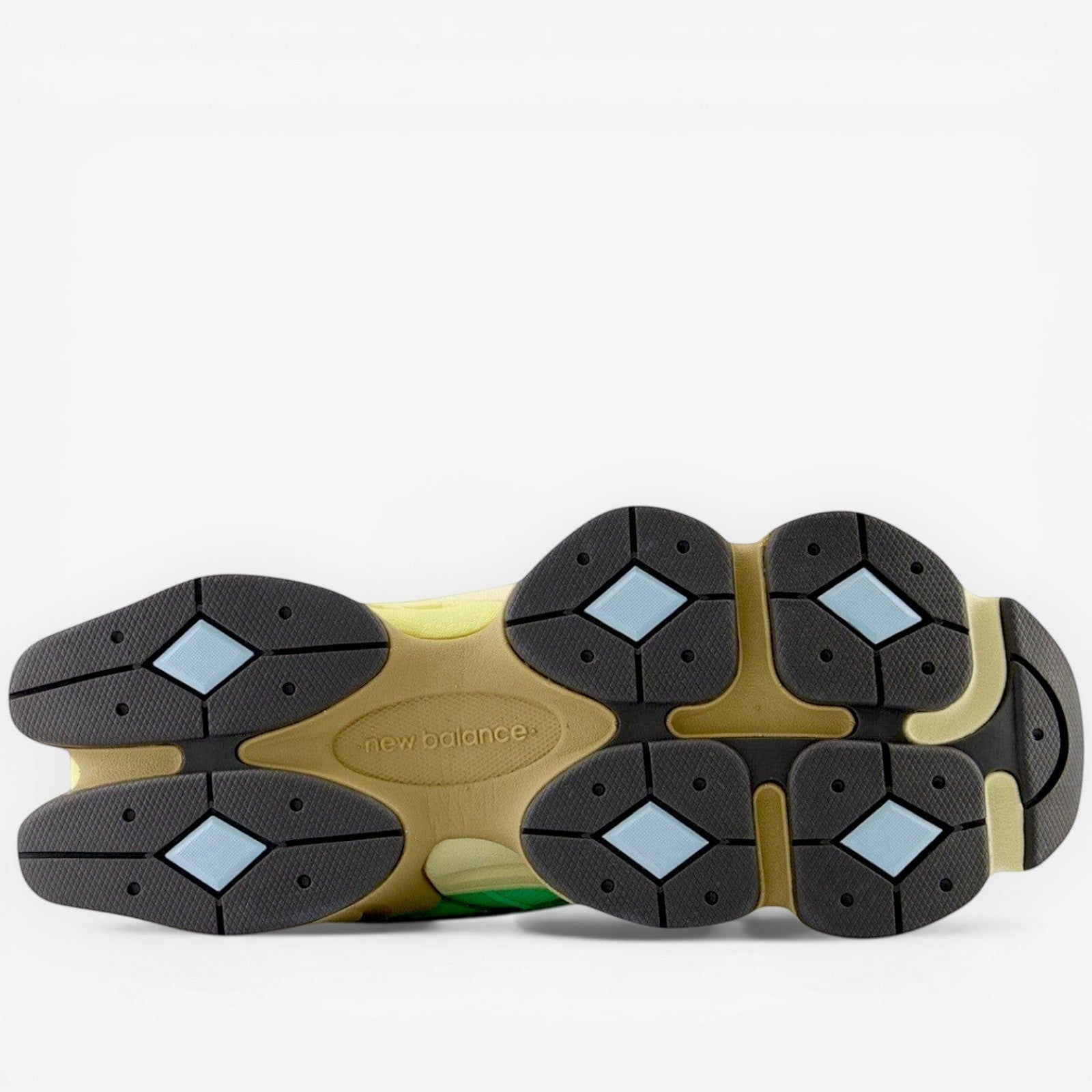 New Balance sneaker outsole with beige, black, and blue accents, part of footwear collection