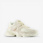 METRO New Balance 9060 unisex sneakers in white and gray, featuring mesh and suede overlays, ABZORB cushioning, and a rubber outsole.