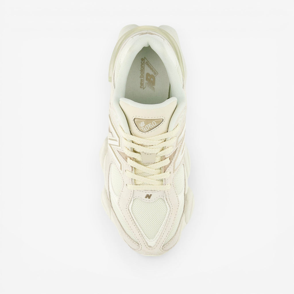 METRO New Balance 9060 sneakers in white and gray, featuring mesh and suede, ABZORB cushioning, and a rubber sole.