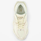 METRO New Balance 9060 sneakers in white and gray, featuring mesh and suede, ABZORB cushioning, and a rubber sole.