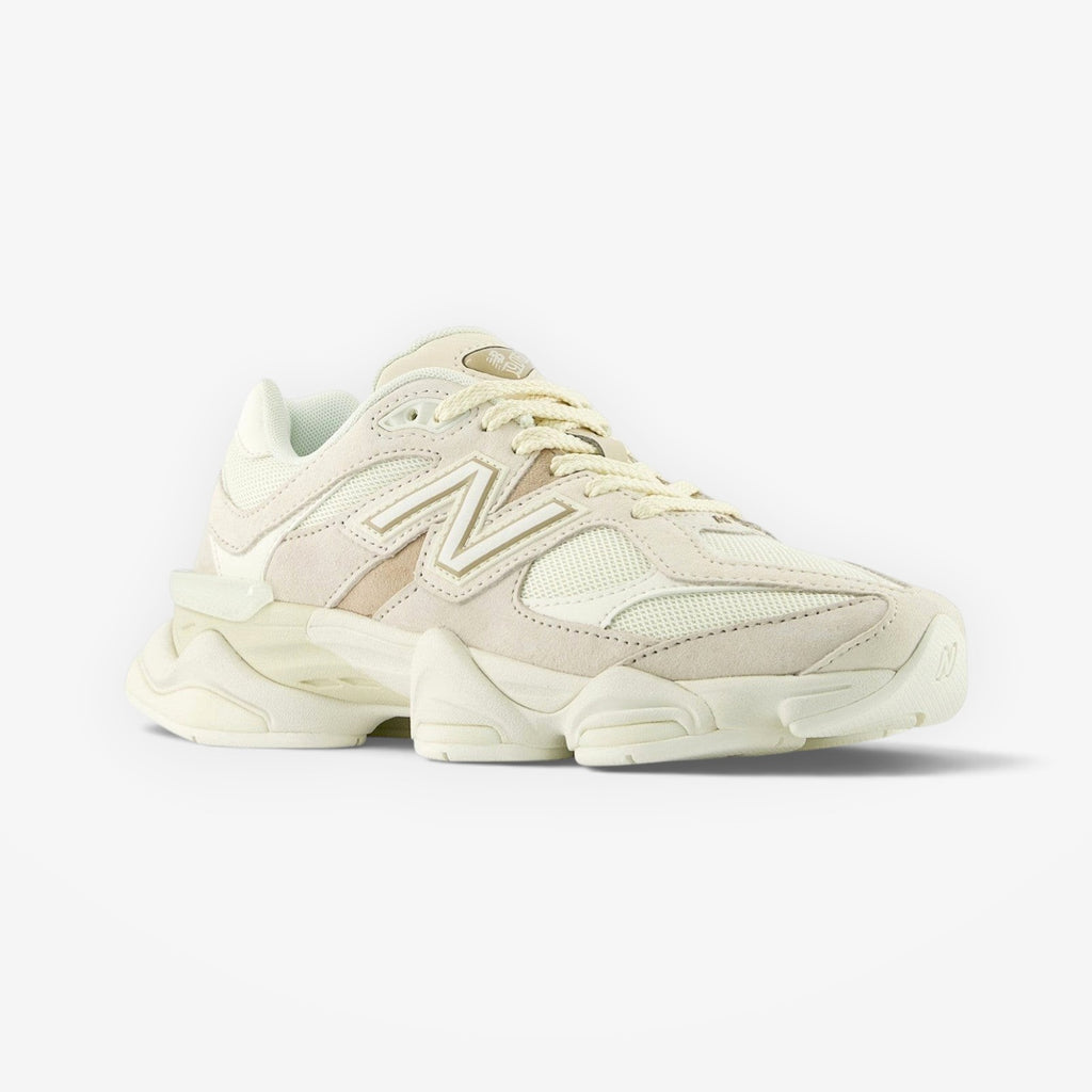 METRO New Balance 9060 unisex sneakers in white and gray, featuring mesh and suede overlays, ABZORB cushioning, and a rubber outsole.