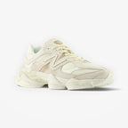 METRO New Balance 9060 unisex sneakers in white and gray, featuring mesh and suede overlays, ABZORB cushioning, and a rubber outsole.