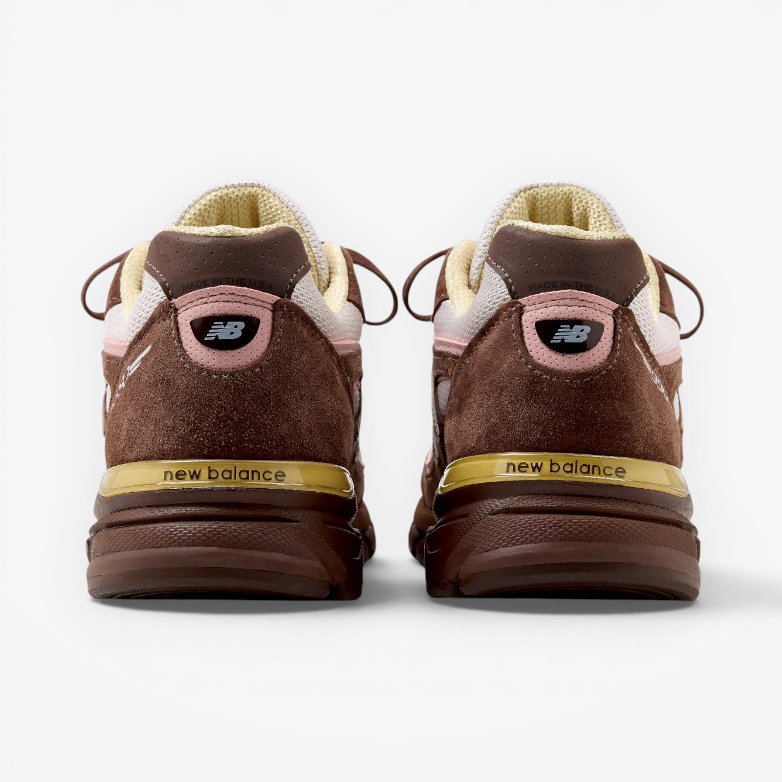 METRO New Balance 990v4 Made in USA sneakers in pumpernickel brown suede with pink and alabaster accents, rear view.