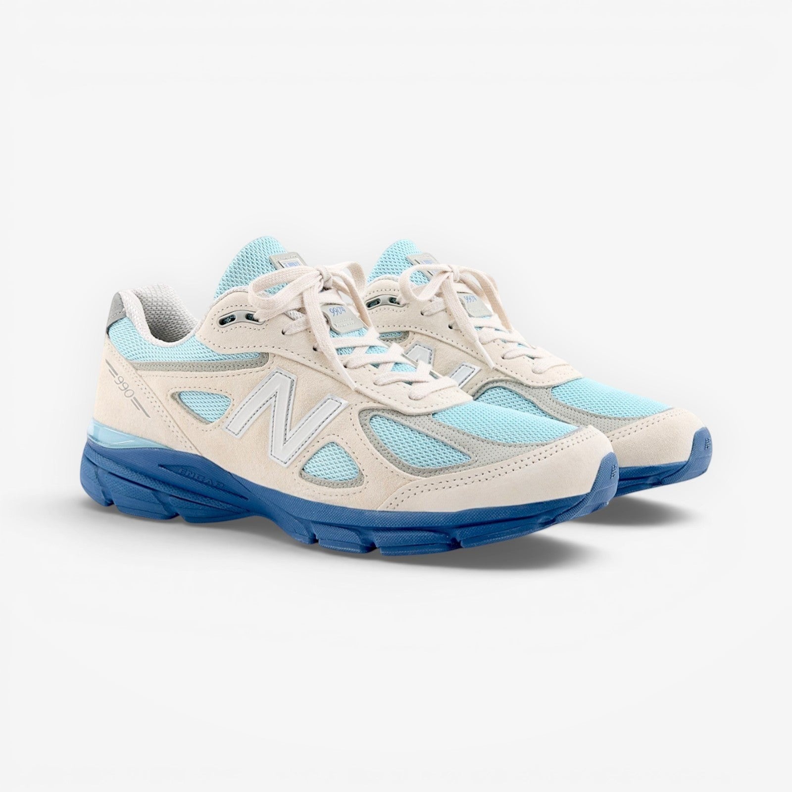 METRO New Balance 990v4 Made in USA sneakers in moonbeam suede with cloud blue mesh and magic blue accents.