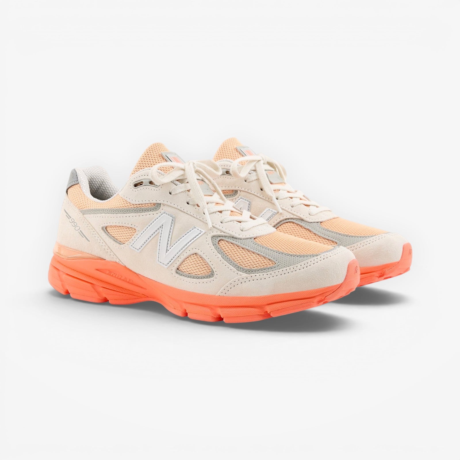 METRO New Balance 990v4 Made in USA sneakers in moonbeam, tangerine heat, and dried orange suede and mesh with ENCAP sole.