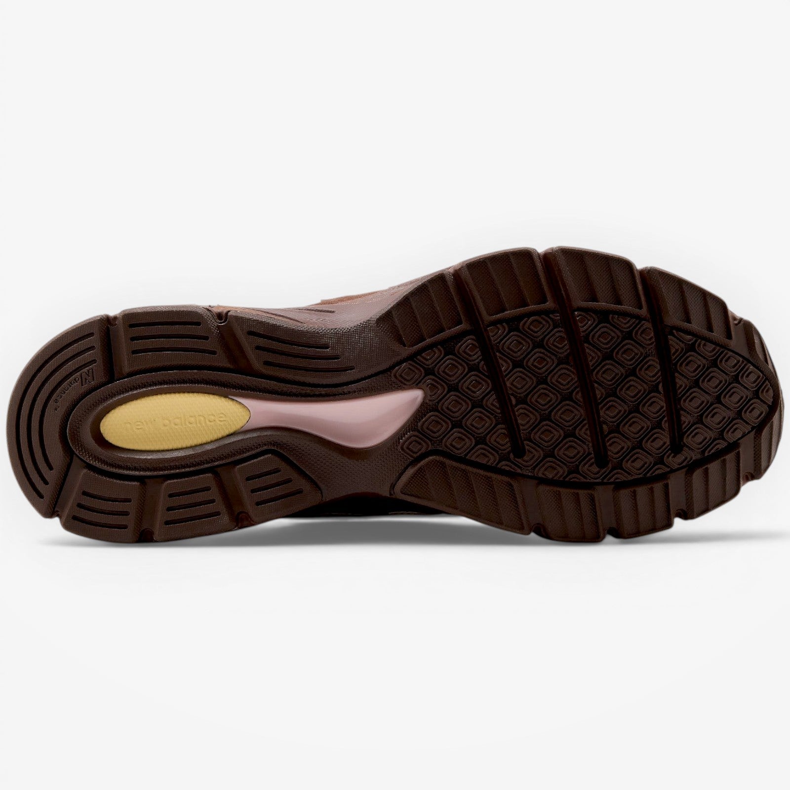 METRO New Balance 990v4 Made in USA sneaker outsole in brown with pink and alabaster accents