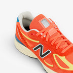 METRO New Balance 990v4 Made in USA Urgent Red Maize Afterglow suede and mesh running shoes.