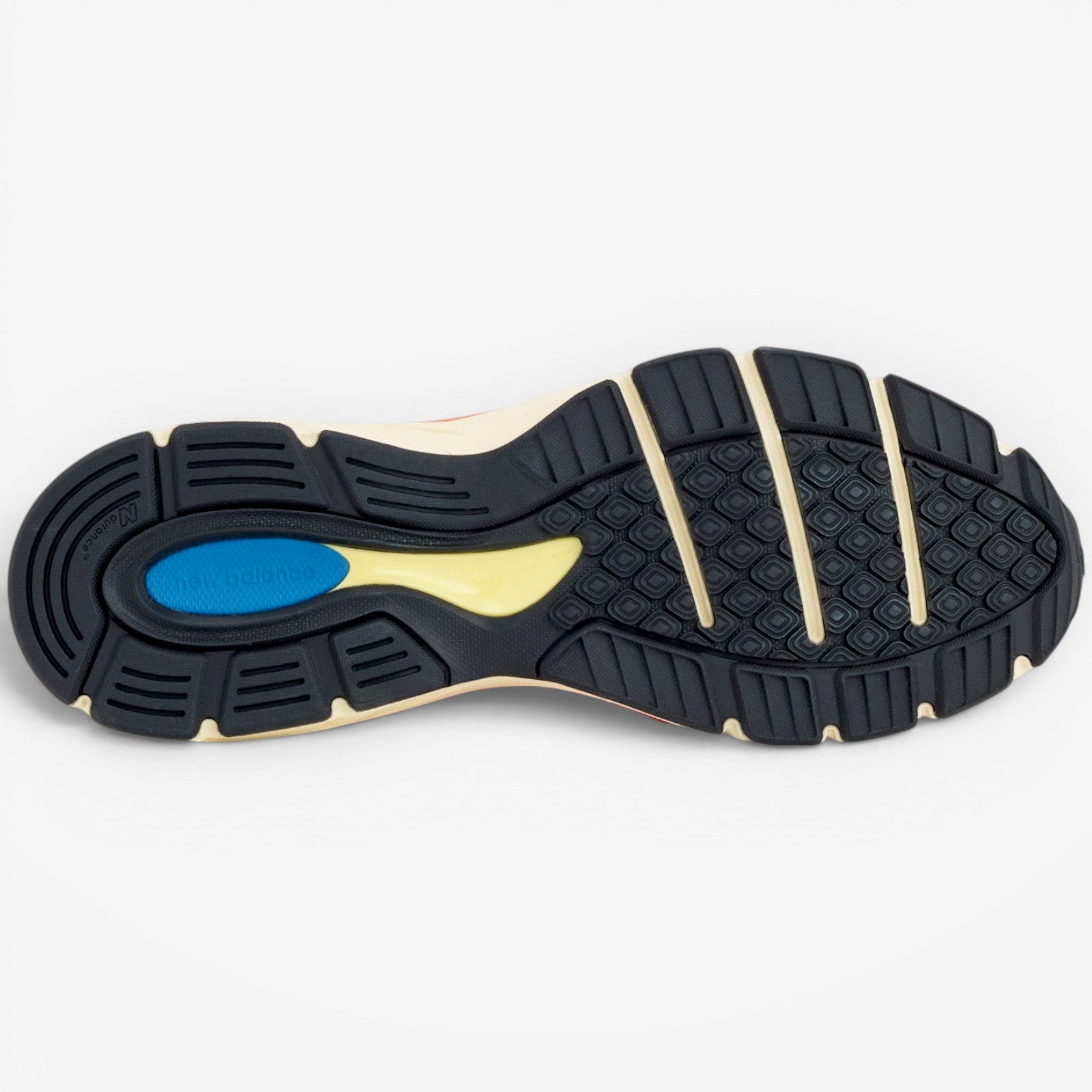 METRO New Balance 990v4 Made in USA Urgent Red Maize Afterglow sneaker sole with black, yellow, and blue accents.