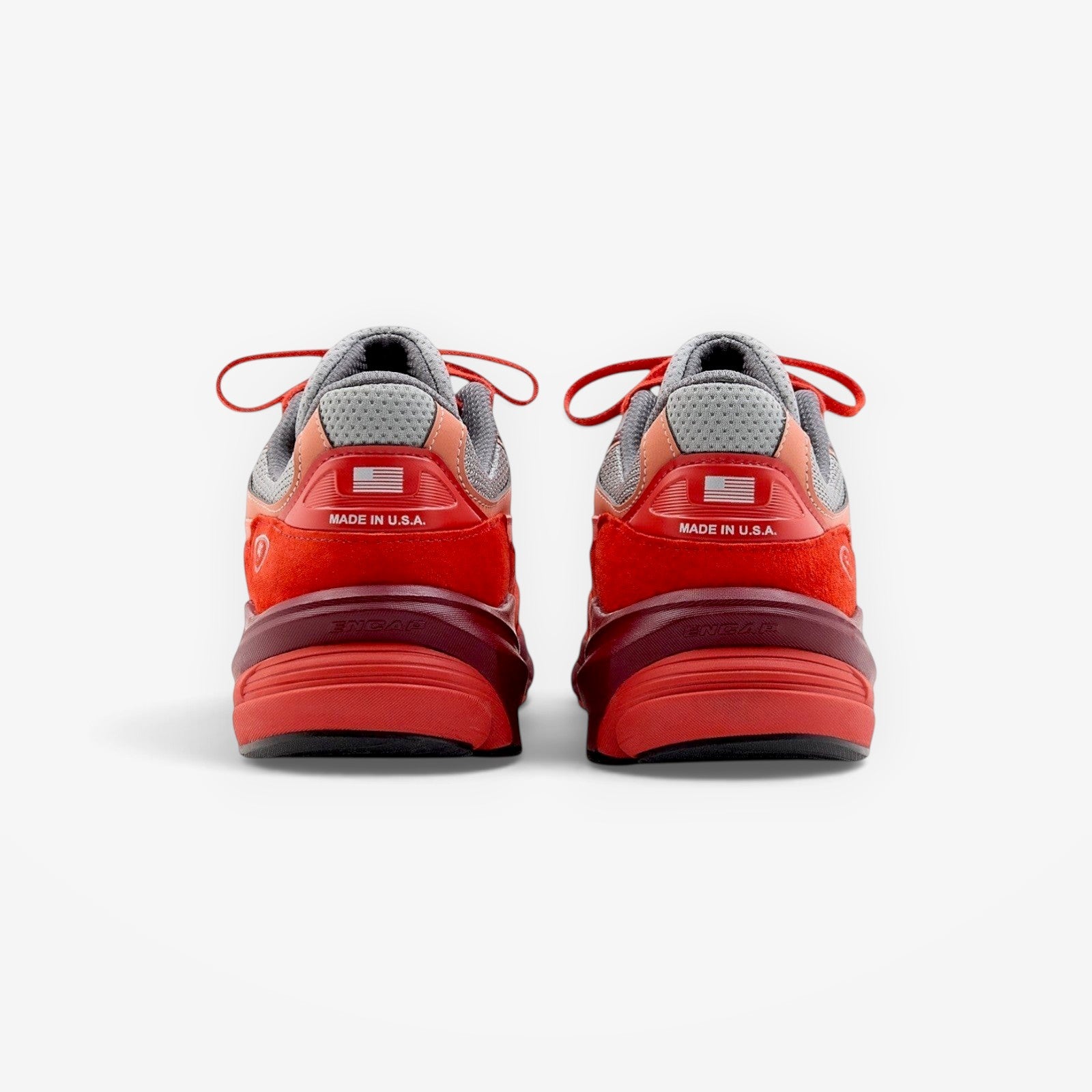METRO New Balance 990v6 Community Red sneakers showing the rear view with Made in USA branding and red suede details.