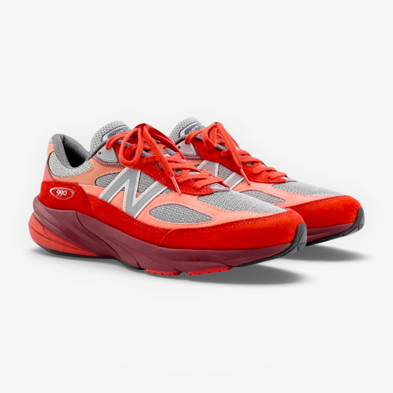 METRO New Balance 990v6 Community Red sneakers featuring a mesh and suede upper with vibrant red and pink color blocking.