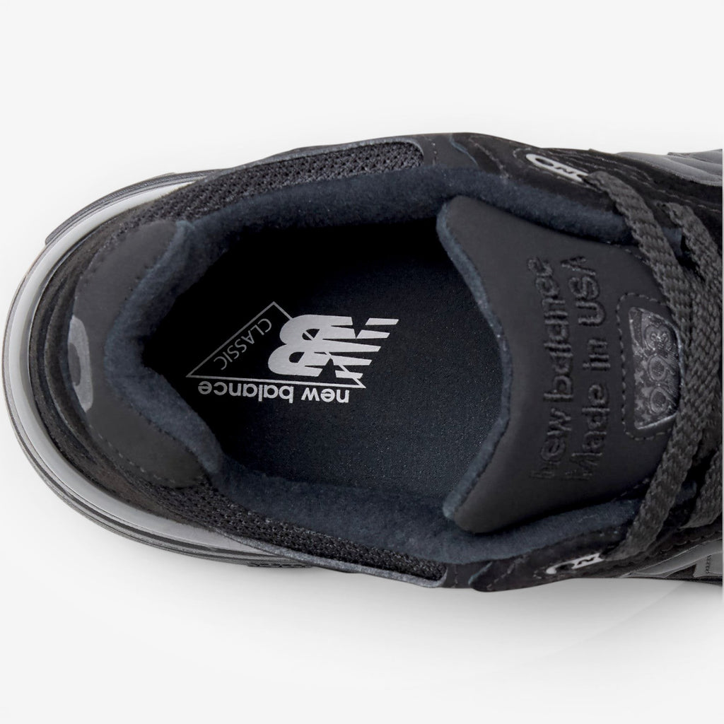 METRO New Balance 993 Made in USA sneaker in triple black featuring a branded insole and premium suede construction.