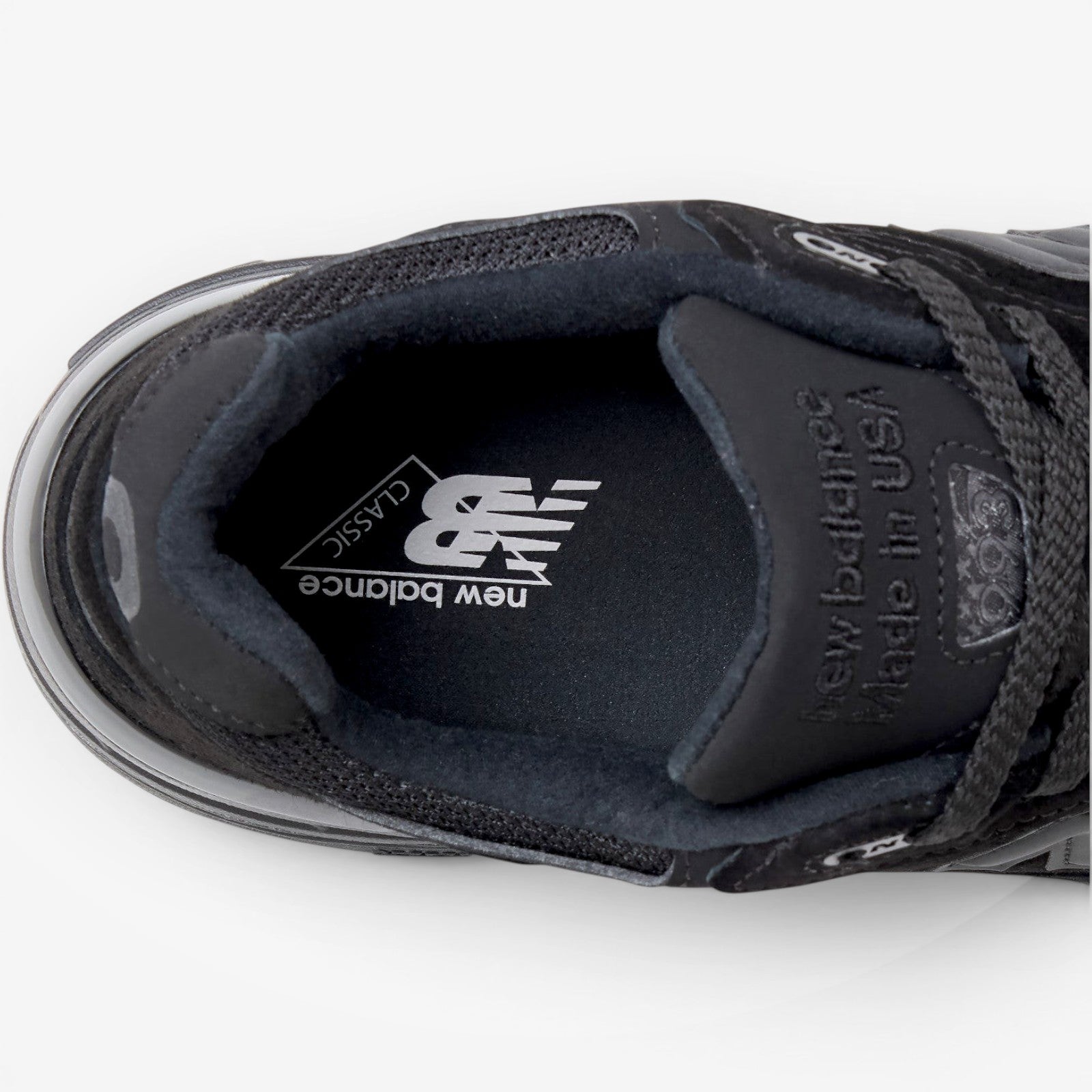 METRO New Balance 993 Made in USA sneaker in triple black featuring a branded insole and premium suede construction.
