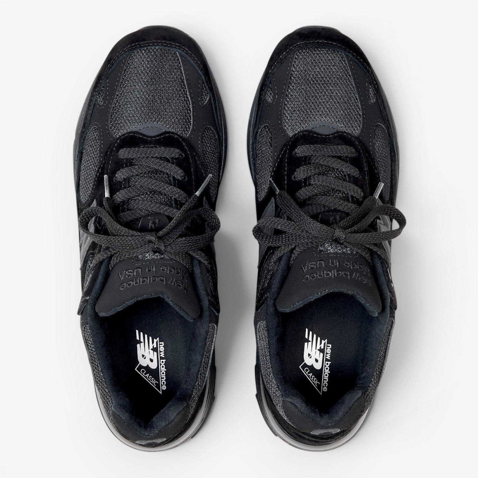 METRO New Balance 993 Made in USA sneakers in triple black featuring premium suede and mesh from a top-down view.