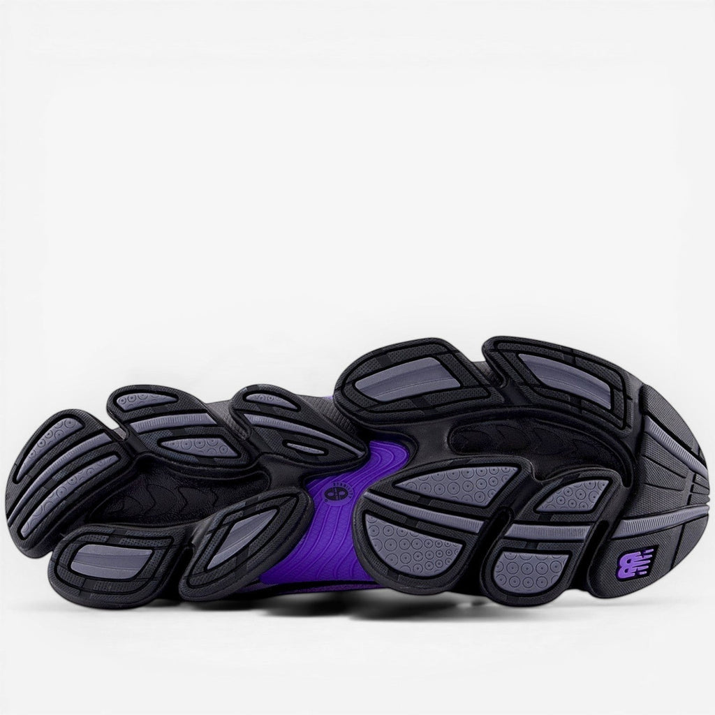 New Balance sneaker outsole in black, grey, and purple, athletic footwear sole detail
