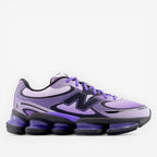 Purple New Balance sneaker on black background, mesh and synthetic, athletic footwear