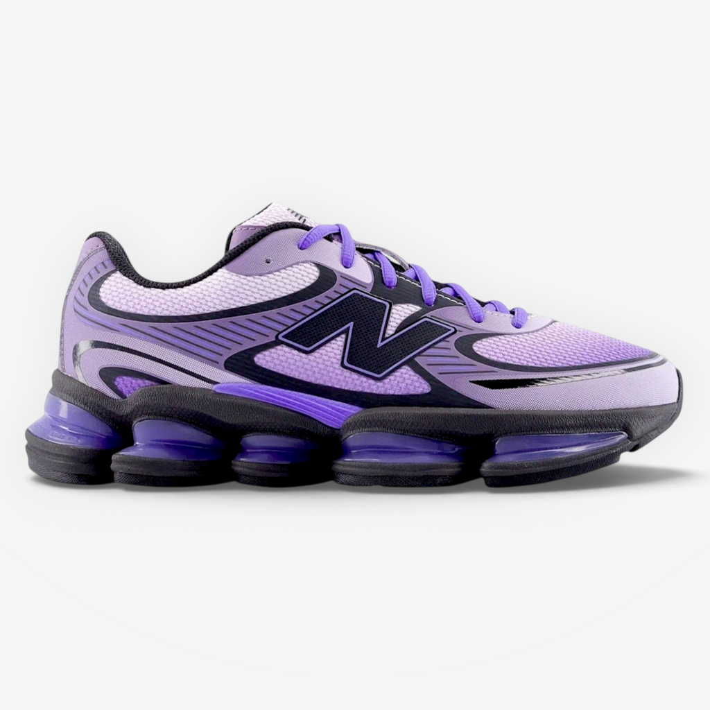 Purple New Balance sneaker on black background, mesh and synthetic, athletic footwear