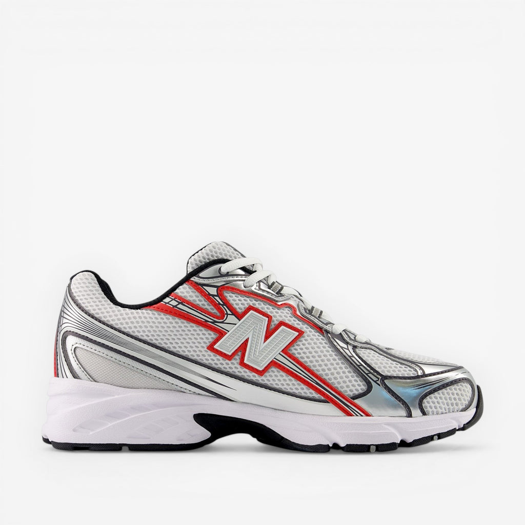 White running shoe with red accents on a white background