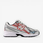 White running shoe with red accents on a white background