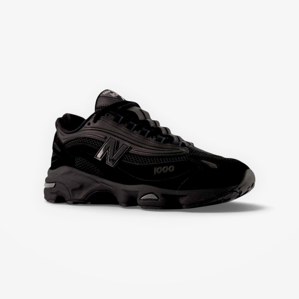 METRO New Balance M1000 black sneaker with mesh underlays, suede overlays, and ABZORB cushioning technology.