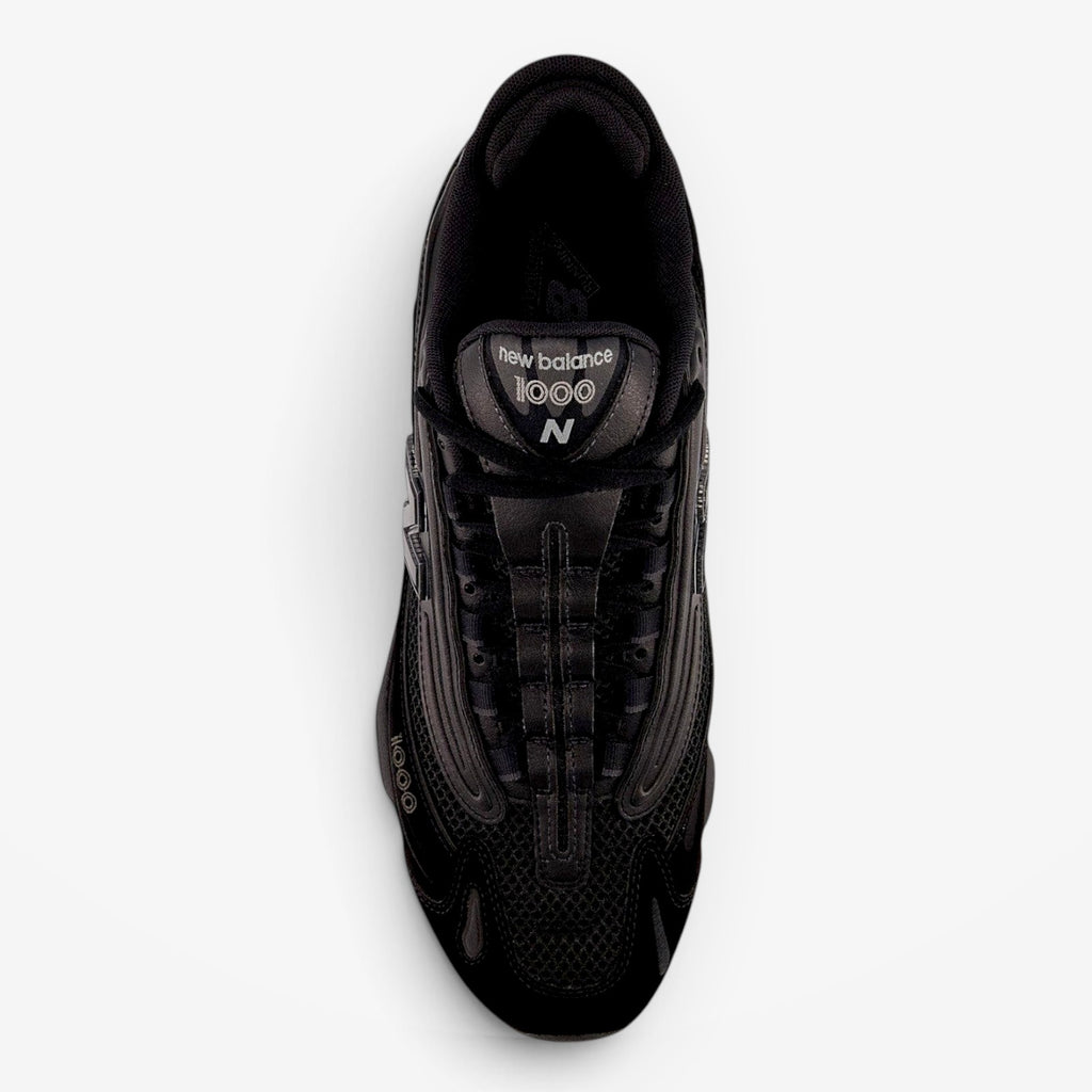 METRO New Balance M1000 black sneakers with mesh underlays and ABZORB cushioning, top-down view.