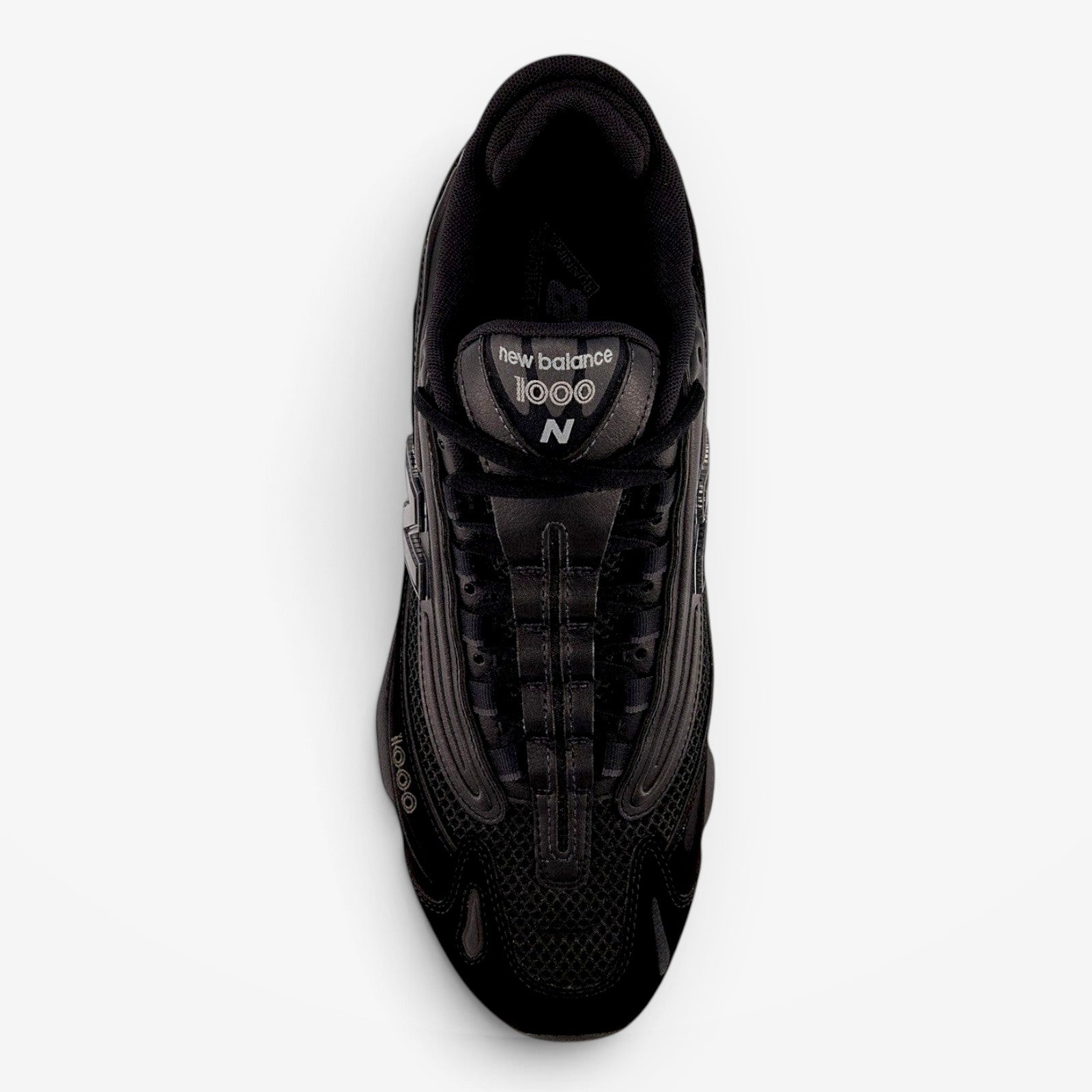 METRO New Balance M1000 black sneakers with mesh underlays and ABZORB cushioning, top-down view.