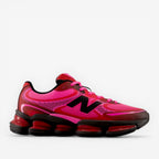 Pink and black athletic shoe on a white background